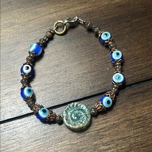 Handcrafted Blue Evil Eye Beaded Bracelet with Green Ceramic Center